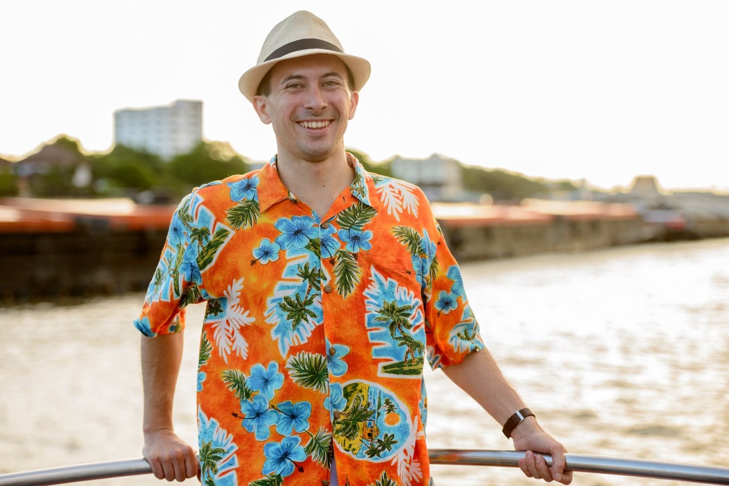 happy young handsome tourist man at pier against v 6hgmvej.jpg